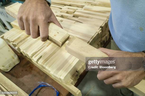 Worker assembles finger joint wood pieces at the Center for Technological Woodworking Development in Machagai, Chaco province, Argentina, on...