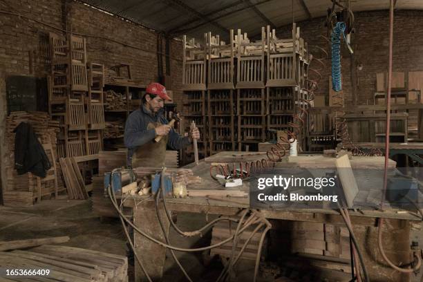 Worker assembles a chair at a woodshop in Machagai, Chaco province, Argentina, on Wednesday, Sept. 6, 2023. The majority state-owned Chaco Forestry...