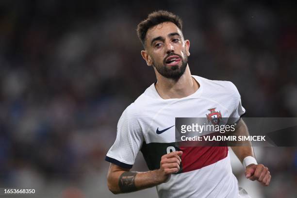 Portugal's midfielder Bruno Fernandes celebrates scoring the opening goal during the UEFA EURO 2024 qualifying football match between Slovakia and...