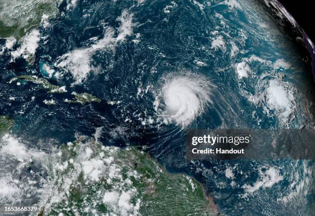 In this NOAA image taken by the GOES satellite, Hurricane Lee crosses the Atlantic Ocean as it moves west on September 8, 2023. Lee reached Category...