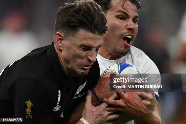 New Zealand's full-back Beauden Barrett and France's scrum-half and captain Antoine Dupont fights for the ball during the France 2023 Rugby World Cup...