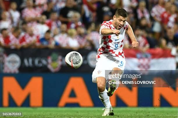 Croatia's forward Andrej Kramaric shoots towards goal during the UEFA Euro 2024 football tournament group D qualification football match between...