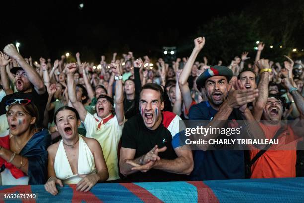 France supporters react as they watch the opening match of the 2023 Rugby World Cup between France and New Zealand at a fan zone in Toulouse,...