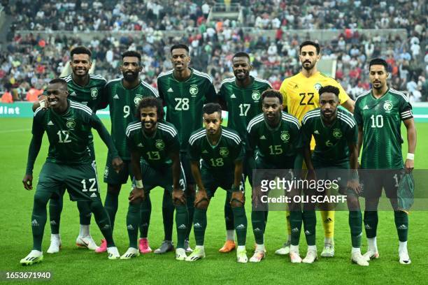 Saudi Arabia's squad defender Ali Al-Bulaihi, forward Firas Al-Buraikan, midfielder Mohamed Kanno, defender Hassan Al-Tambakti, goalkeeper Nawaf...