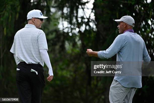 Kevin Sutherland talks with Rocco Mediate as they walk to the ninth hole during the first round of the Ascension Charity Classic at Norwood Hills...