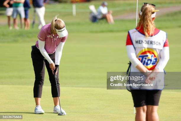 Golfer Brooke Henderson putts on the 13th hole during the second round of the Kroger Queen City Championship at the Kenwood Country Club in...