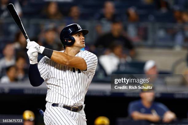 Jasson Dominguez of the New York Yankees hits a two-run home run against the Milwaukee Brewers during the third inning of a game at Yankee Stadium on...