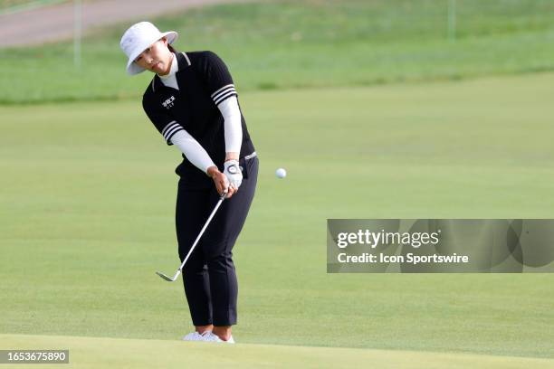 Golfer Amy Yang chips on the 13th hole during the second round of the Kroger Queen City Championship at the Kenwood Country Club in Cincinnati, Ohio.
