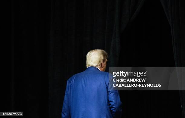 Former US president and 2024 Republican Presidential hopeful Donald Trump leaves the stage after speaking during the South Dakota Republican Party's...