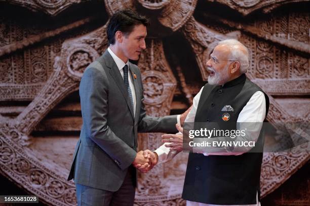 India's Prime Minister Narendra Modi shakes hand with Canada's Prime Minister Justin Trudeau ahead of the G20 Leaders' Summit in New Delhi on...