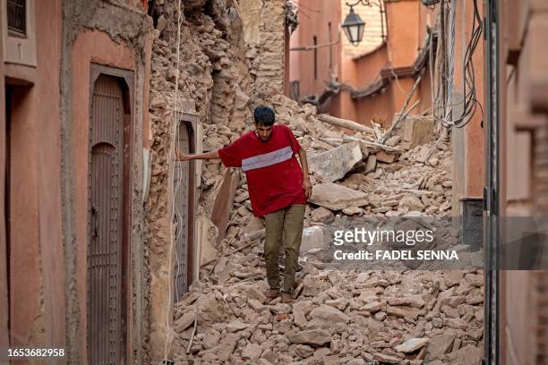 Resident navigates through the rubble following a 6.8-magnitude quake in Marrakesh on September 9, 2023. A powerful earthquake that shook Morocco...