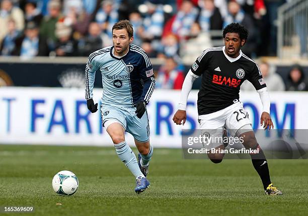 Bobby Convey of Sporting Kansas City moves the ball with Sheanon Williams of Philadelphia Union defending during the MLS game at PPL Park on March 2,...