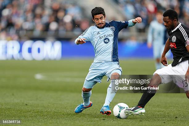 Paulo Nagamura of Sporting Kansas City challenges Michael Lahoud of Philadelphia Union for the ball during the MLS game against the Philadelphia...