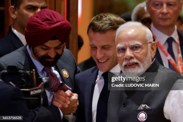 France's President Emmanuel Macron , India's Prime Minister Narendra Modi and World Bank President Ajay Banga arrive for the second session of G20...