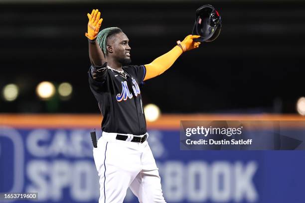 Ronny Mauricio of the New York Mets reacts after hitting a double in his first career at-bat during the third inning of the game against the Seattle...