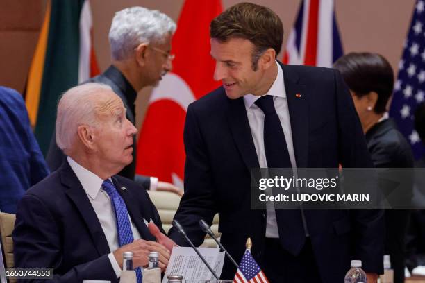 France's President Emmanuel Macron greets US President Joe Biden before the start of the second working session meeting at the G20 Leaders' Summit at...