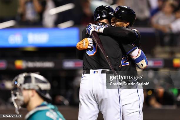 Francisco Lindor of the New York Mets greets Brandon Nimmo after Nimmo hit a solo home run during the sixth inning of the game against the Seattle...