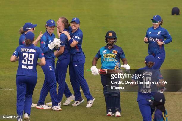 England's Lauren Filer celebrates with team-mates after taking the wicket of Sri Lanka's Hasini Perera during the first one day international match...