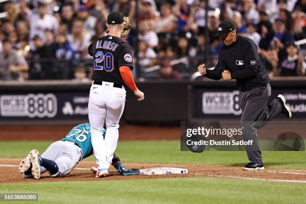 José Caballero of the Seattle Mariners is picked off at first base during the ninth inning of the game against the New York Mets at Citi Field on...