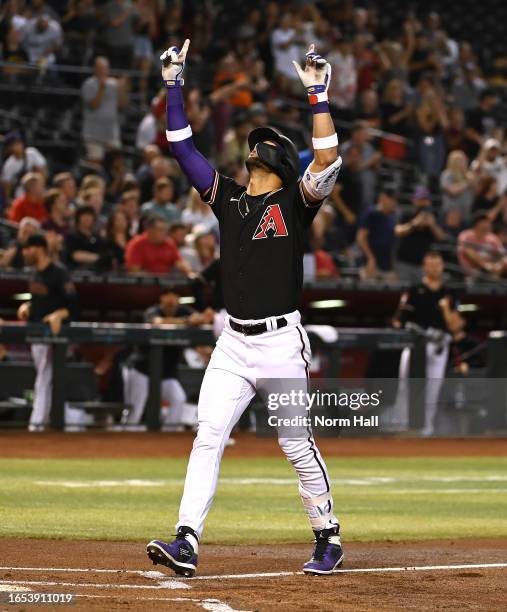 Lourdes Gurriel Jr of the Arizona Diamondbacks gestures toward the sky after hitting a two-run home run against the Baltimore Orioles during the...