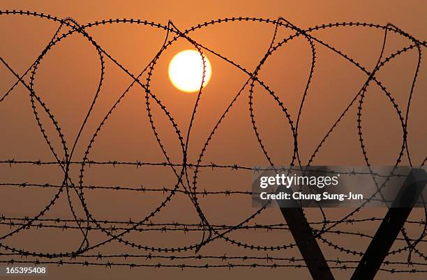 Barbed wire fence at the military check point, near the Demilitarized zone separates South and North Korea on April 4, 2013 in Paju, South Korea. 400...