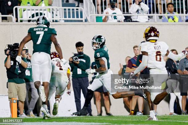 Jalen Berger of the Michigan State Spartans runs for a touchdown in the third quarter of a game against the Central Michigan Chippewas at Spartan...