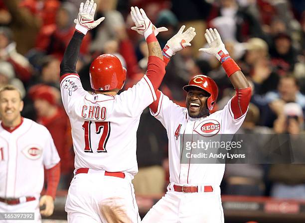 Brandon Phillips of the Cincinnati Reds celebrates with Shin-Soo Choo after Choo scored the winning run in the 9th inning against the Los Angeles...