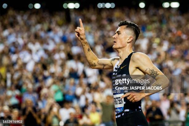 Norwegian Jakob Ingebrigtsen celebrates as he crosses the finish line to win the men's 2000m at the 2023 edition of the Memorial Van Damme Diamond...