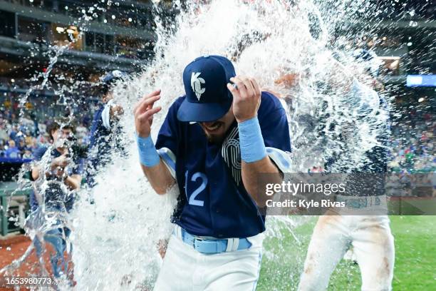 Nick Loftin of the Kansas City Royals has water dumped on him by teammates while celebrating after defeating the Boston Red Sox at Kauffman Stadium...