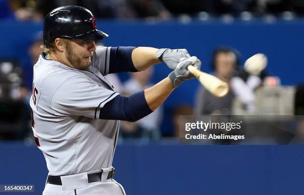 Mark Reynolds of the Cleveland Indians homers in the 11th inning to take the lead against the Toronto Blue Jays during MLB action at the Rogers...