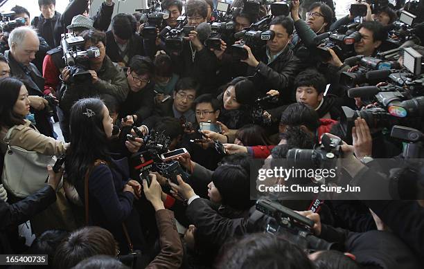 South Korean worker Kwon Suk-Mi, arriving from the Kaesong Kaesong joint industrial complex in North Korea, is speaks to reporters at the...