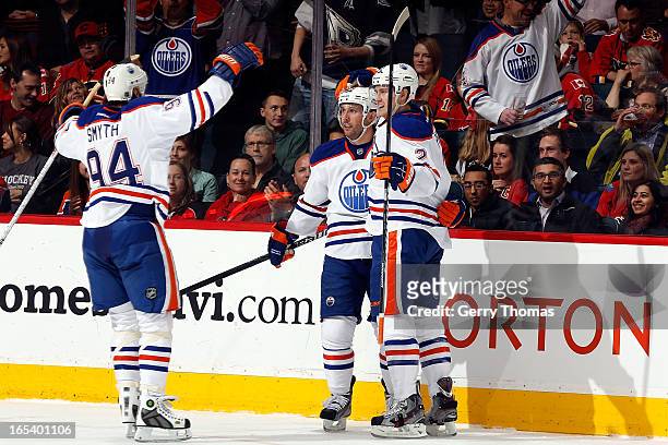 Ryan Smyth, Sam Gagner and Jeff Petry of the Edmonton Oilers celebrate a goal against the Calgary Flames on April 3, 2013 at the Scotiabank...