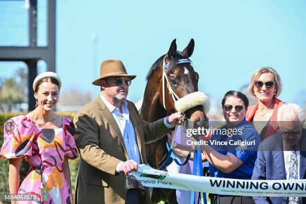 Trainers Katherine Coleman and Peter Moody pose after Nunthorpe won Race 3, the Fierce Impact - Pedigree Performance, during Melbourne Racing at...