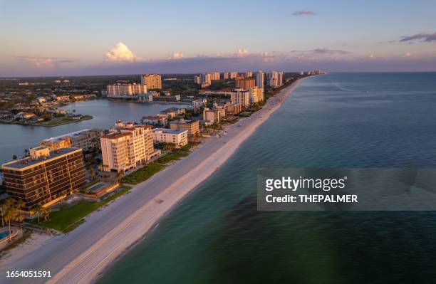 aerial drone photo naples vanderbilt beach florida, at sunset - naples stock pictures, royalty-free photos & images