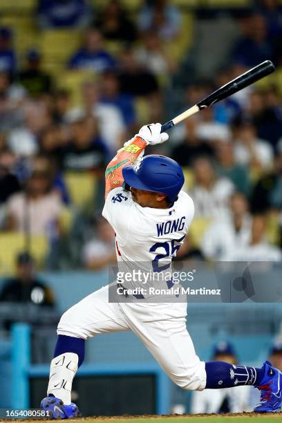 Kolten Wong of the Los Angeles Dodgers hits a three-run home run against the Atlanta Braves in the eighth inning at Dodger Stadium on September 01,...