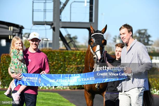 Winning connections Jack Riewoldt and daughter Poppy Riewoldt and Tom Lynch pose after Soulcombe won Race 6, the Tile Importer Heatherlie Stakes,...