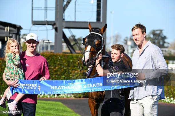 Winning connections Jack Riewoldt and daughter Poppy Riewoldt and Tom Lynch pose after Soulcombe won Race 6, the Tile Importer Heatherlie Stakes,...
