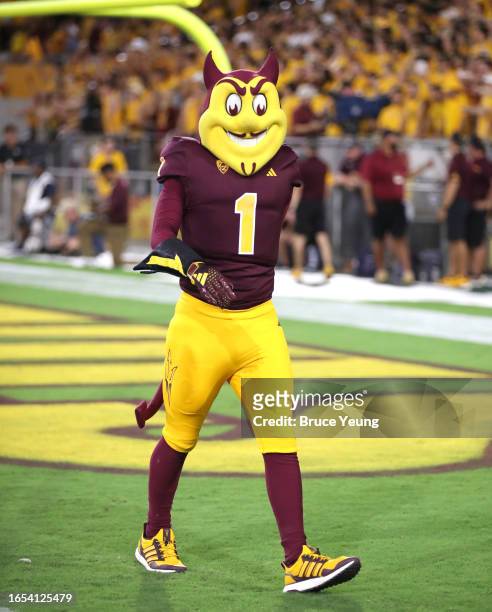 Arizona State Univeristy mascot Sparky walks towards the sidelines during the first quarter against the Southern Utah Thunderbirds at Sun Devil...