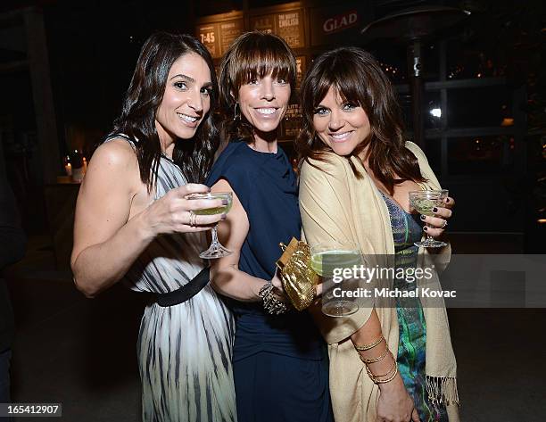 Actress Tiffani Thiessen and friends Karen Zambos and Lesley Feldman toast at her One Bag Party, sponsored by Glad Trash, where just one bag of trash...