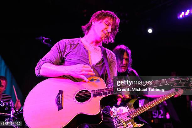 Singer/guitarist John Rzeznik and bassist Robby Takac of the Goo Goo Dolls perform live at Troubadour on April 3, 2013 in West Hollywood, California.