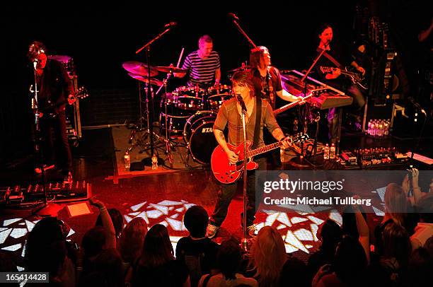 Musicians Brad Fernquist, Mike Malinin, John Rzeznik, Robby Takac and Korel Tunador of the Goo Goo Dolls perform live at Troubadour on April 3, 2013...