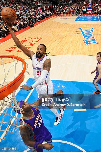 Ronny Turiaf of the Los Angeles Clippers shoots in the lane against Jermaine O'Neal of the Phoenix Suns at Staples Center on April 3, 2013 in Los...