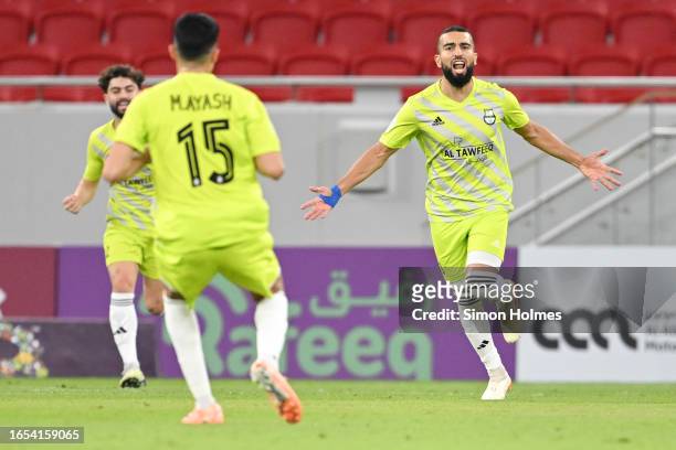 Naïm Sliti of Al Ahli celebrates after scoring in the Qatar Stars League match between Al Ahli and Al Gharafa at Al Thumama Stadium on September 01,...