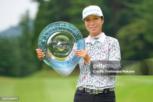 Ji-Hee Lee of South Korea poses with the trophy after winning the tournament following the final round of San-In Goen Musubi Ladies at Daisen Heigen...