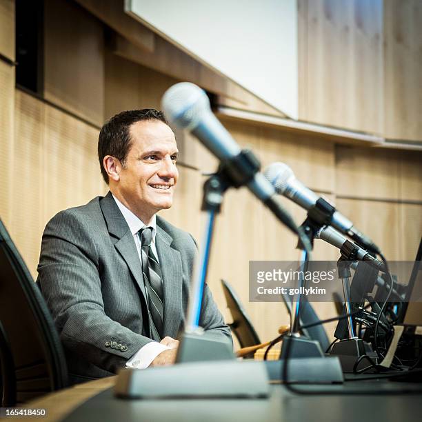 happy politician at the auditorium - politician meeting stock pictures, royalty-free photos & images