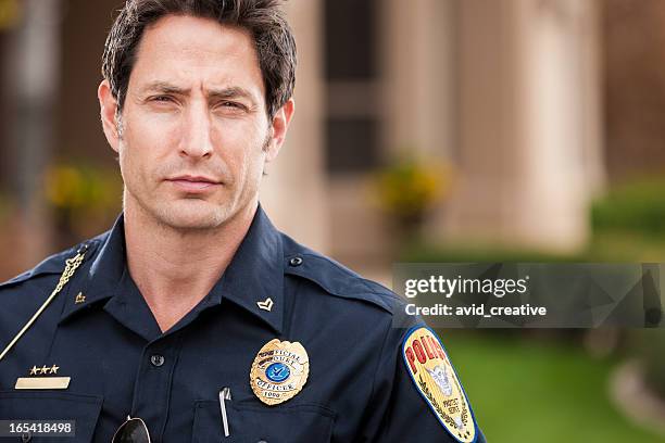 caucasian police officer portrait - military uniform close up stock pictures, royalty-free photos & images