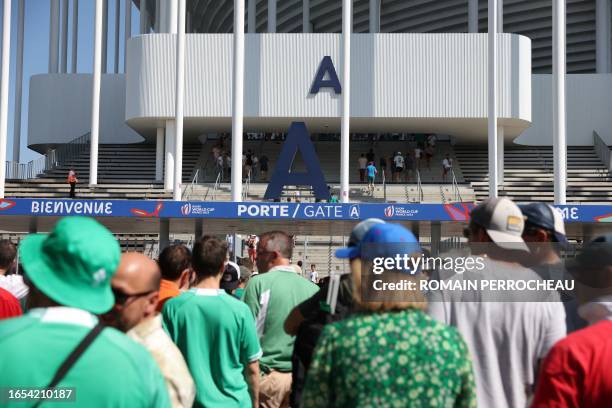 Ireland's supporters queue to enter the stadium ahead of the France 2023 Rugby World Cup Pool B match between Ireland and Romania at Stade de...