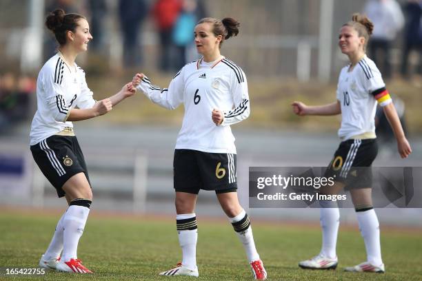 Lina Magull celebrates her team's first goal with Melanie Leupolz and Sara Daebritz of Germany during the Women's UEFA U19 Euro Qualification match...