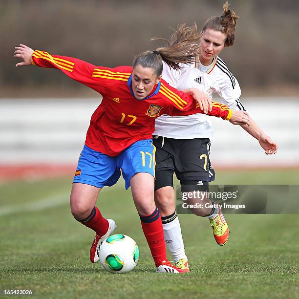 Annabel Jaeger of Germany is challenged by Nuria Mendoza of Spain during the Women's UEFA U19 Euro Qualification match between U19 Germany and U19...