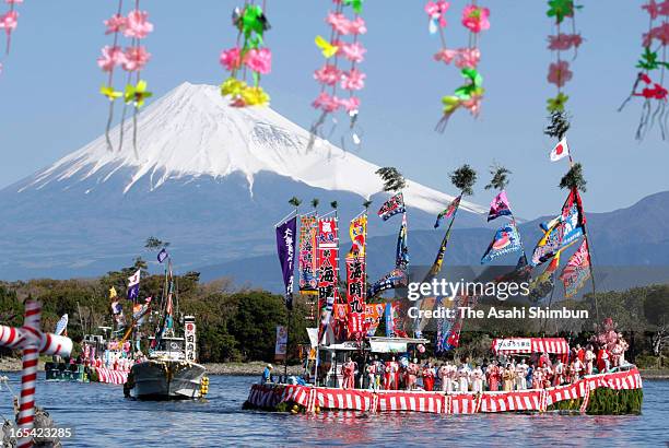 Fishermen and boys dressed and make-up as women dance on a decorated boat during annual Ose Festival at Suruga Bay on April 4, 2013 in Numazu,...